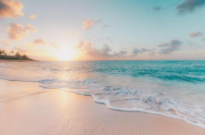 Enjoy the sunset at OCEAN FRONT 1BR Apartment - pool on site!